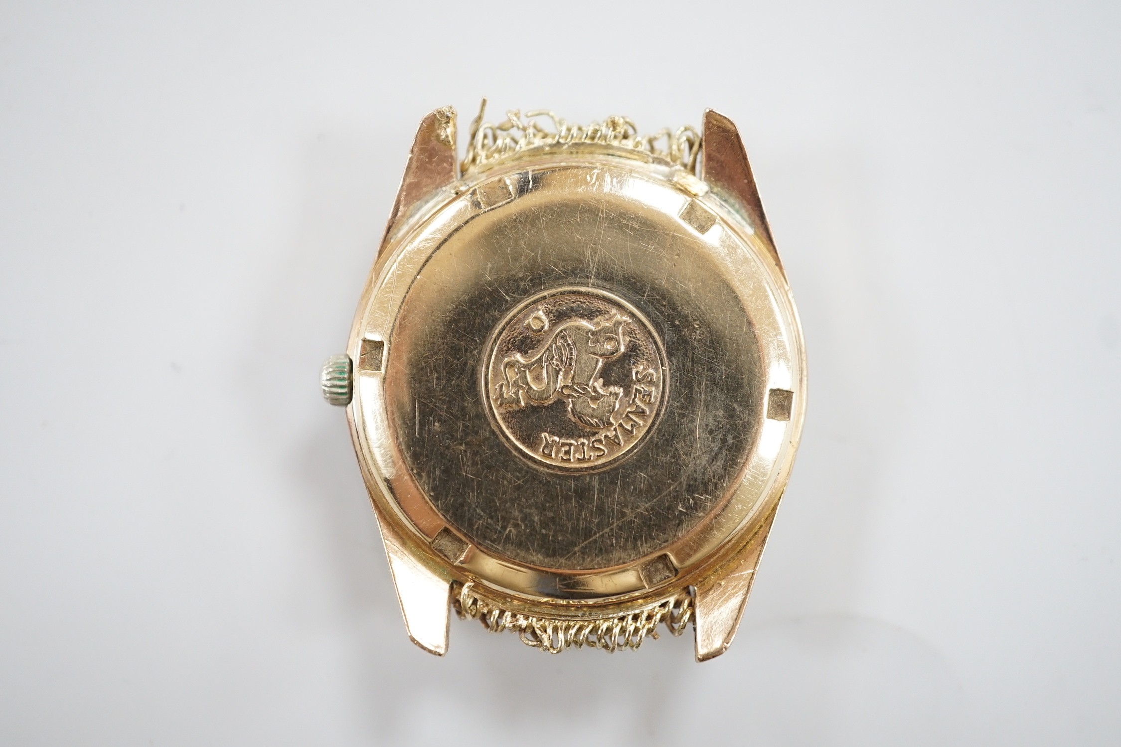 A gentleman's late 1960's 9ct gold Omega Seamaster Automatic day/date wrist watch, (lacking bracelet but remnants still visible), case diameter 36mm, movement c.752, with part paperwork, no box.